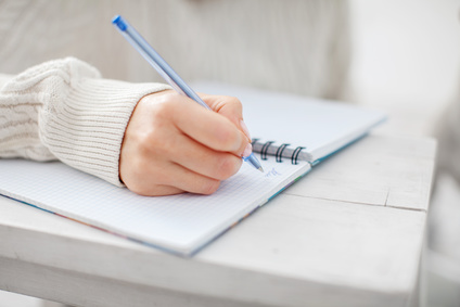 Woman writing pen in notebook. Female writing letter